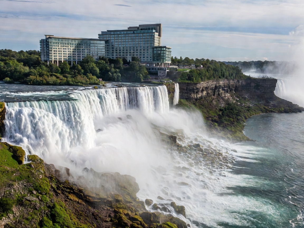 Scenic overview representation of Fallsview Casino Resort perched on a high cliff overlooking the mist of Horseshoe Falls.